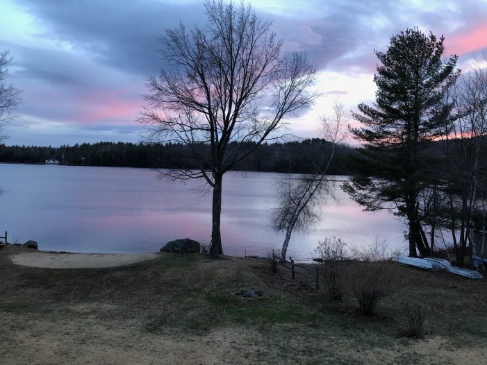 Pink Sky Reflects in Highland Lake at Sunset