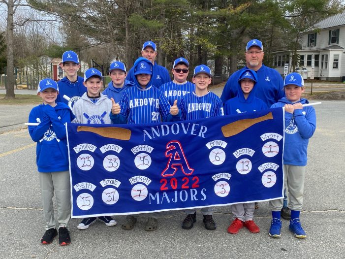 Andover Majors Blue Team Stands with Their Banner