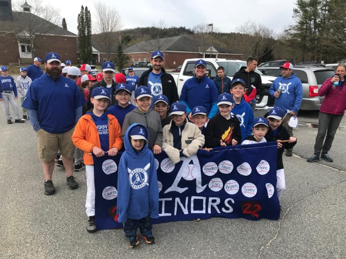 The Minors, a team with Andover Youth Baseball, displays their banner on opening day of the 2022 season