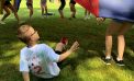Second Grader Observes the Fun From the Ground on Field Day