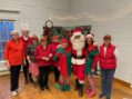 Santa Brings His Elves to Help Out at Hub’s December Party