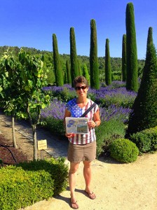 Renee Ratte traveled with her 100th issue of The Andover Beacon to Provence, France during the lavender season the first week of July. She is pictured here wearing her red, white, and blue on the Fourth of July, visiting Chateau Val Joanis Vineyard and Gardens after taking in the 100th running of the Tour de France just south of these gardens in Aix-en-Provence.