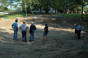 Keith Barrett, Garry George, Don Gould, Jane Slayton, Howard George, and Mike Martin ponder the next steps in creating the AE/MS amphitheater in the natural bowl next to the AE/MS Annex. Photo: Charlie Darling