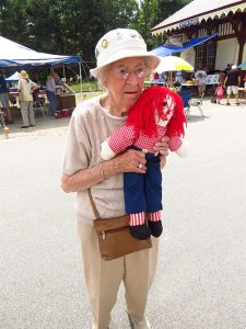 Larry generously "re-gifted" the Raggedy Andy doll from the gift basket to Mrs. Doris Ebel of New London.