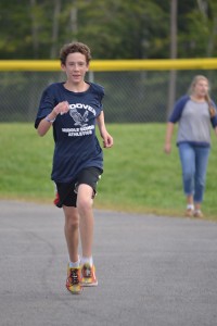 David Reynolds heads for the finish line for the first-ever individual victory for AE/MS Cross Country.