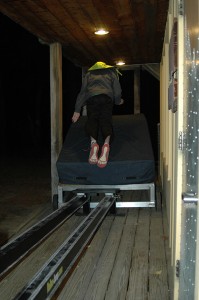 Matthew Reynolds in full flight, headed toward the big landing cushion. The roller jump was set up on the porch of the lodge at Proctor Ski Area.