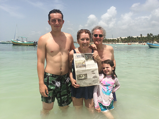 Lois Magenau and Marcus Johnson enjoyed the beautiful beaches in Akumal, Mexico with Lois' grandchildren Quin (left) and Sierra ... and their copy of The Andover Beacon!