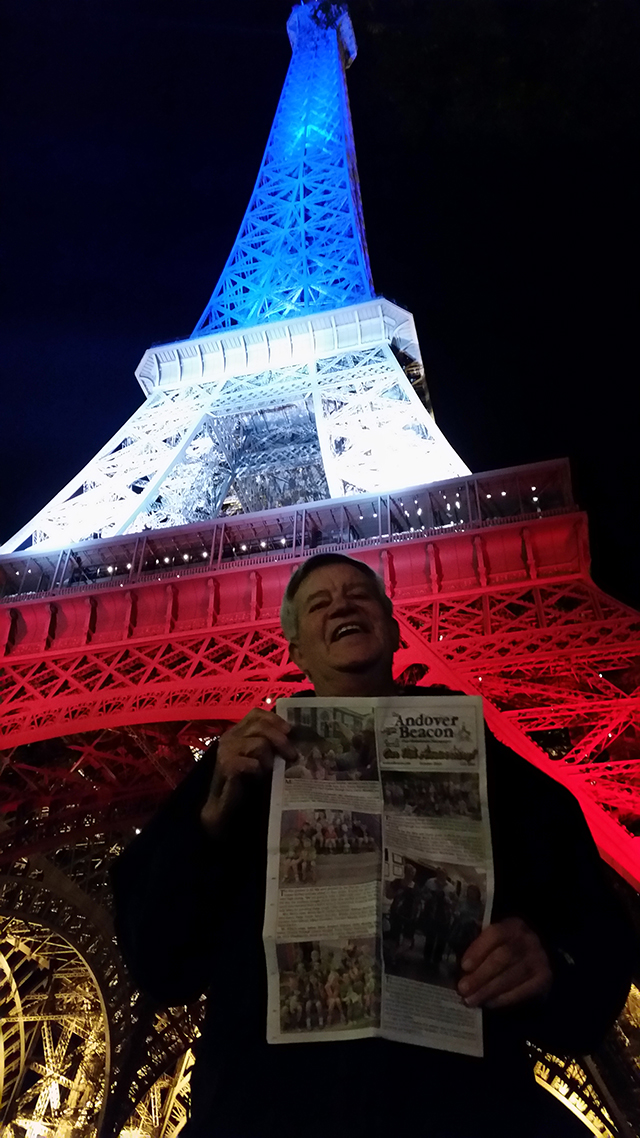 Jim Goody (and his copy of the Beacon) in a stunning night scene at the Eiffel Tower in Paris last month.