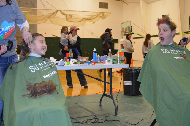 Vanessa Guptill and her mother, Gabi Calderaro, were among the dozens who "braved the chair" on March 26 to help end childhood cancers. Photo: Jill Grotnes