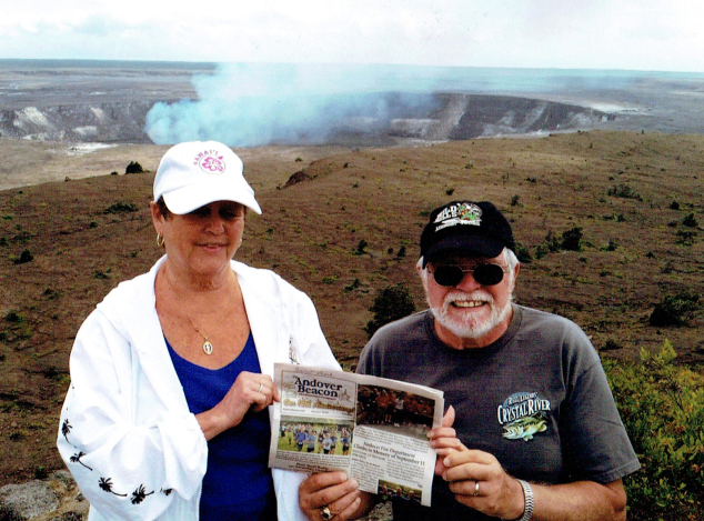 Betty and Dick Adams went to Hawaii for their 50th wedding anniversary recently. Here they are with their copy of The Andover Beacon in front of one of Hawaii's famous volcanoes. "We spent 12 days island hopping, meeting many new friends, and having a great time," Betty reports.