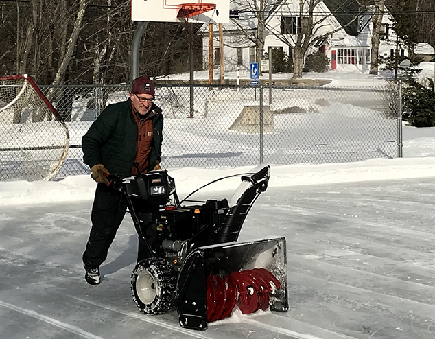 Volunteers Maintain Ice Rink