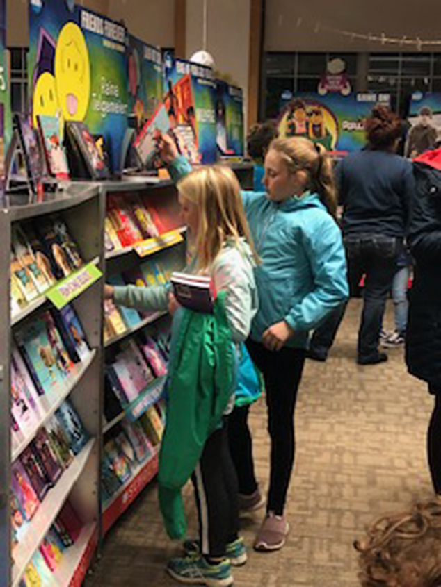 Selecting Books at the AE/MS Book Fair