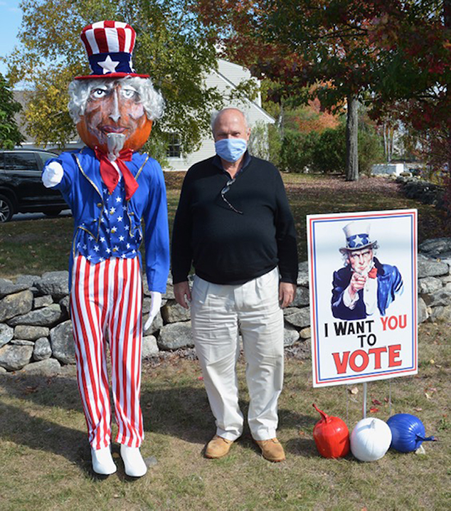 East Andover Resident Pecco Beaufays Has His Picture Taken With Compass Travel’s Pumpkin People