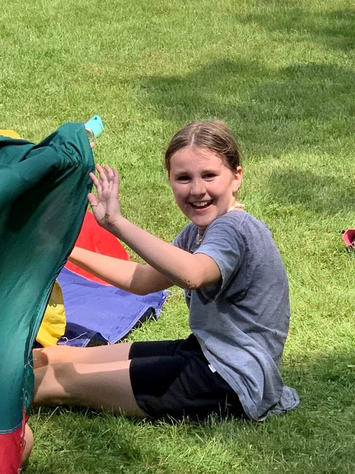 AE/MS Student Plays With A Parachute on Field Day