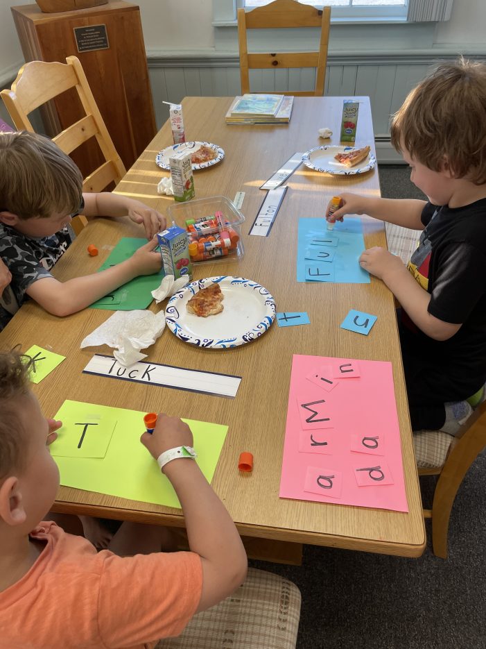 Children Enjoy Pizza and Spelling Their Names