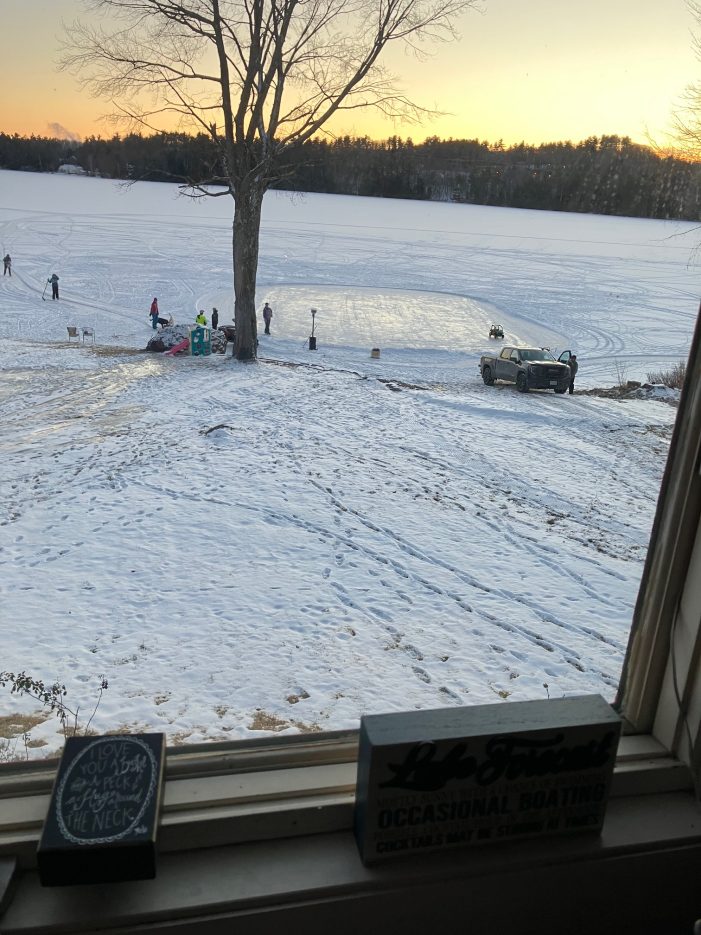 Family Clears an Ice Rink on Highland Lake