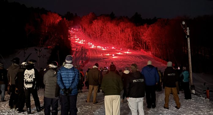 Spectator Photographs Torchlight Parade at Blackwater Ski Area